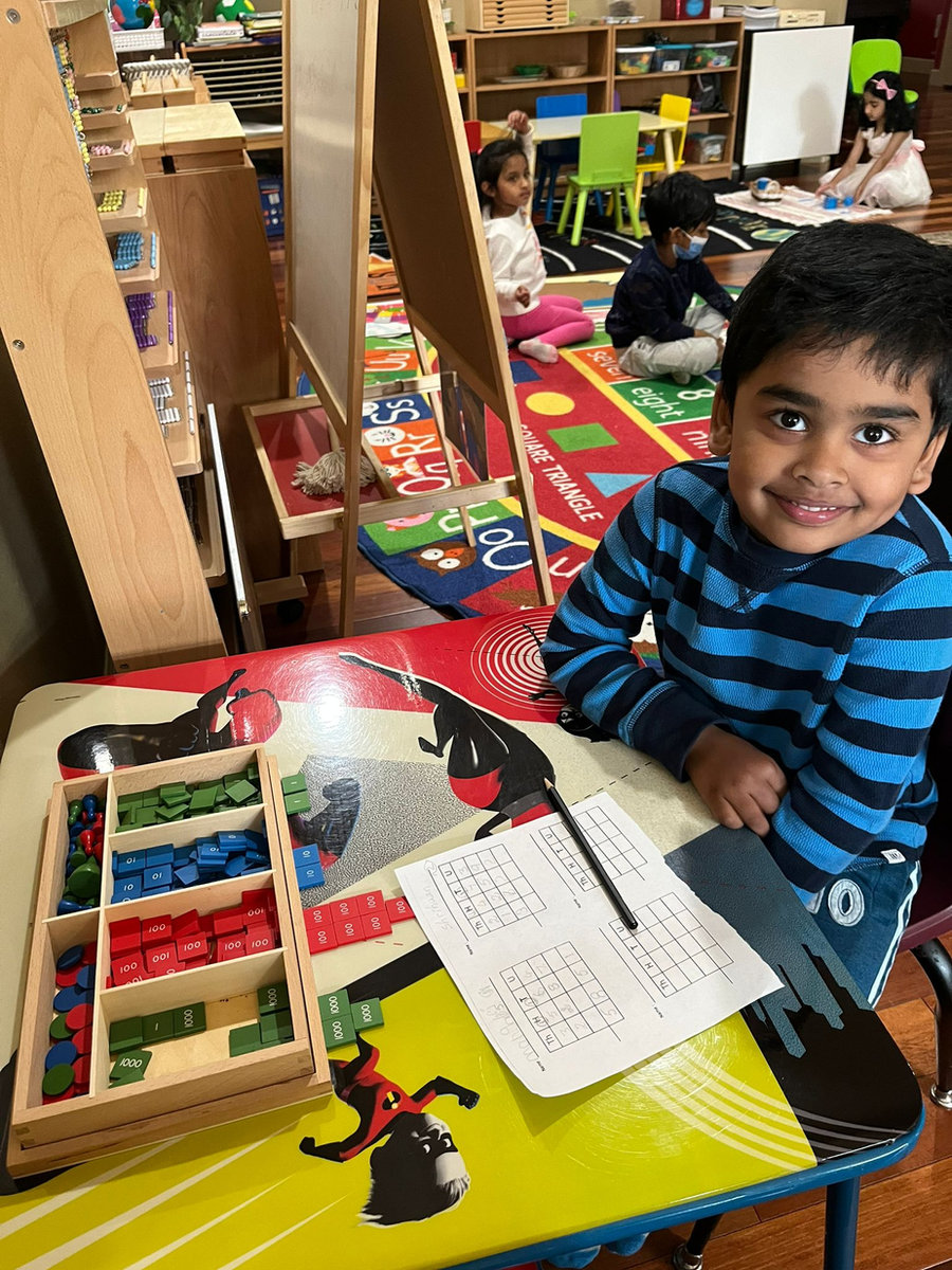 A child exploring number materials